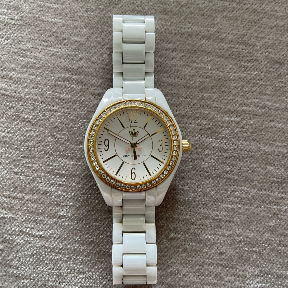 Juicy Couture White and Gold Stainless Steel Water Resistant Watch.
